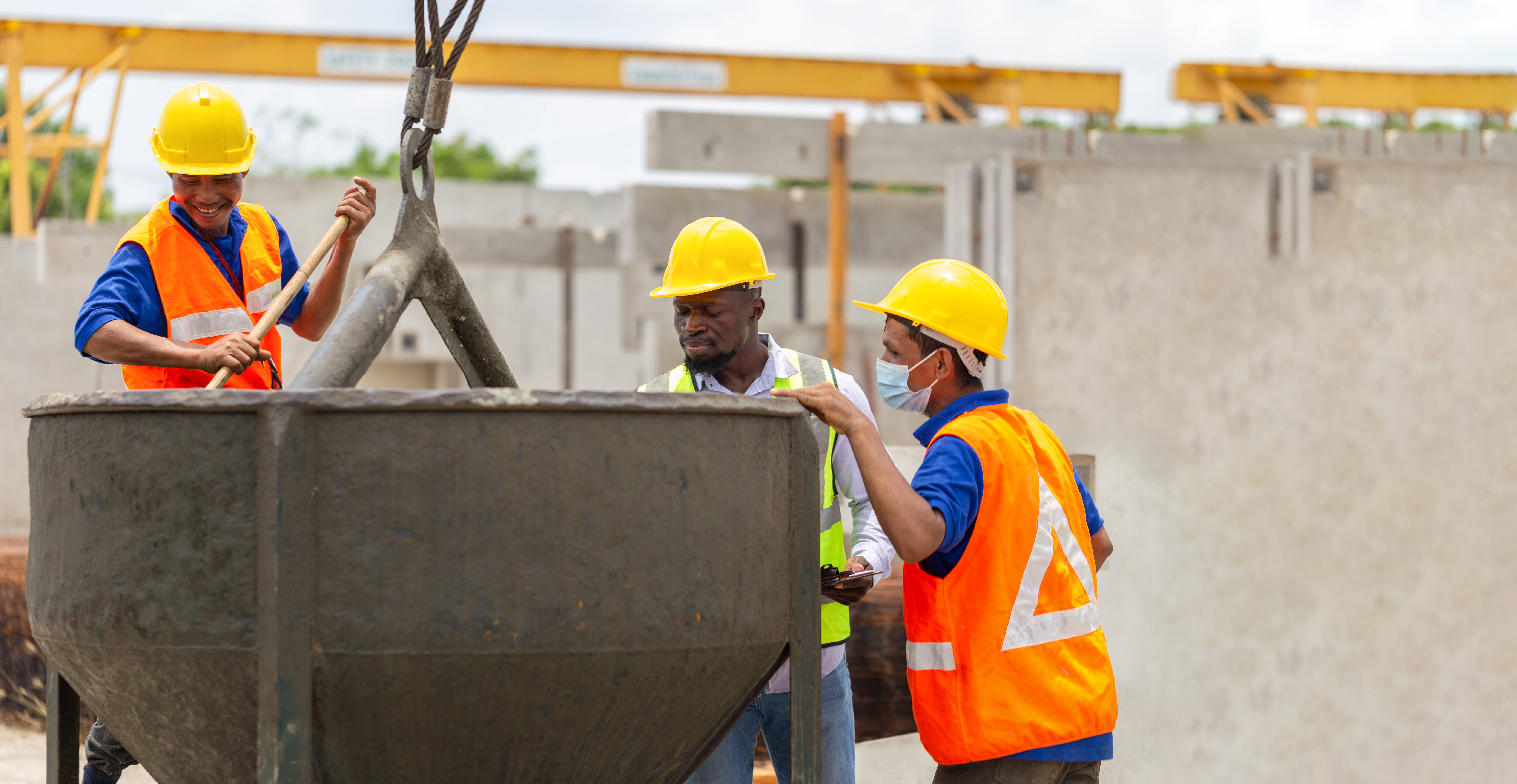 Construction workers at work, Foreman and worker team discussing at precast concrete factory site
